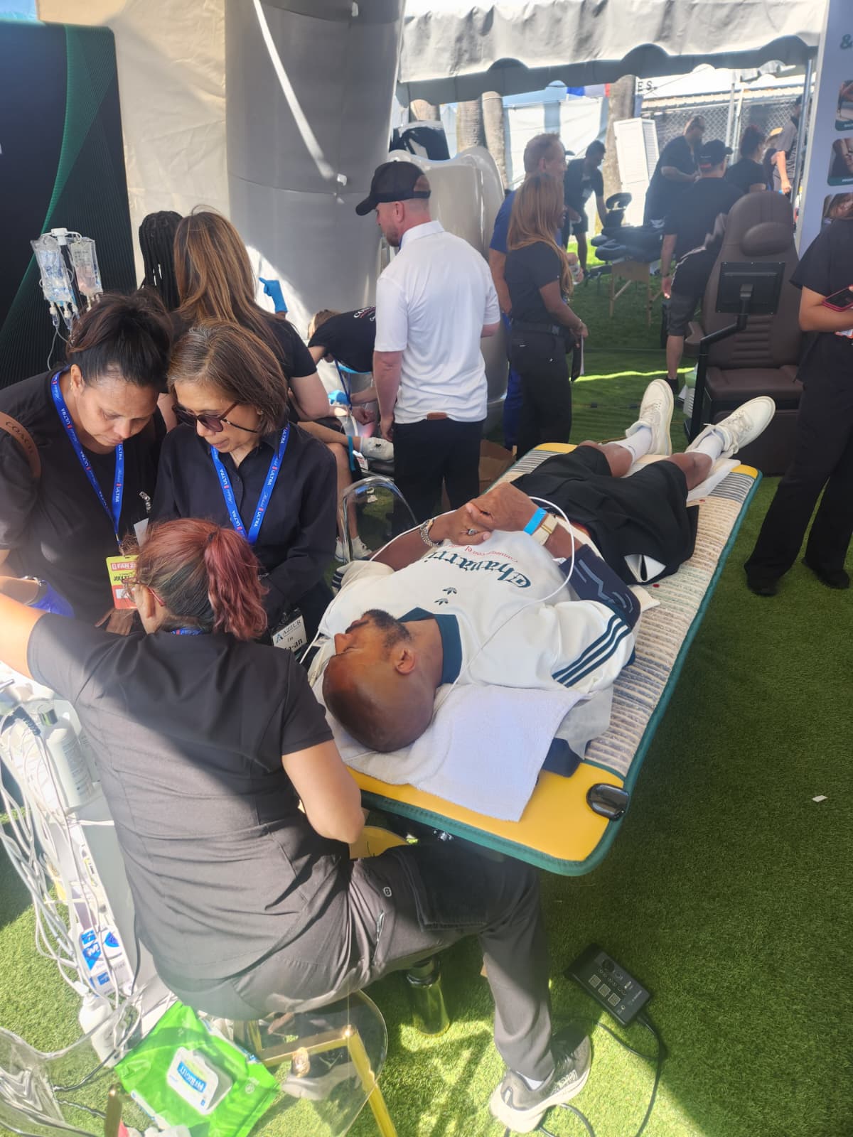 Event setup and attendees inside the on-site tent at the Venice Beach event